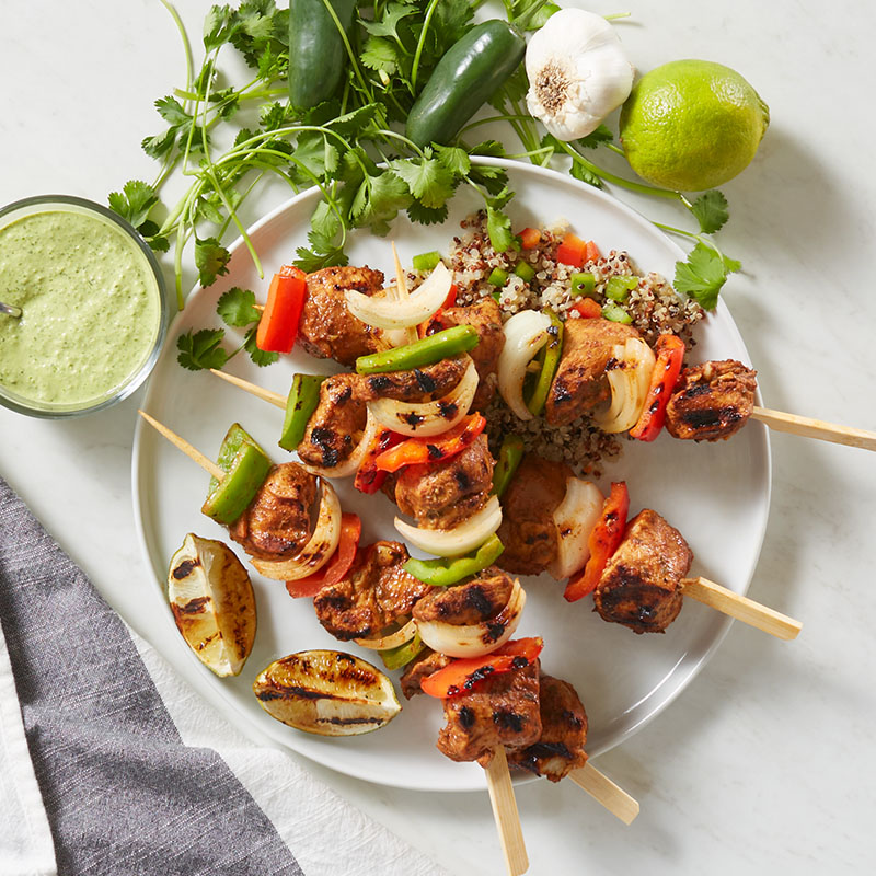 Grilled Peruvian chicken and vegetable kabobs with green sauce